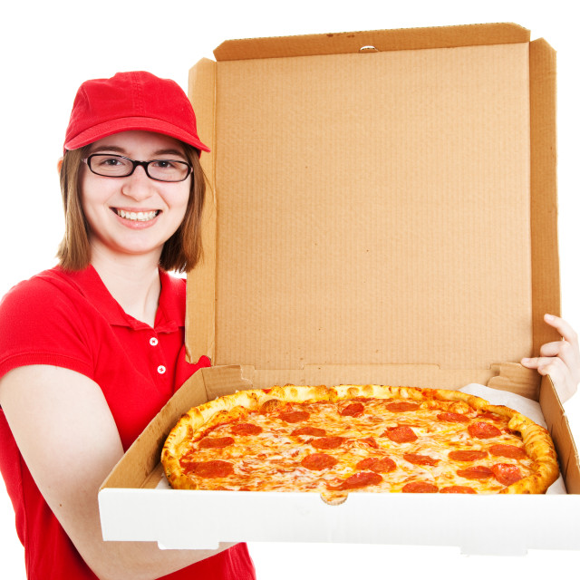 Pretty teenage or young adult girl delivering pizza in uniform. 