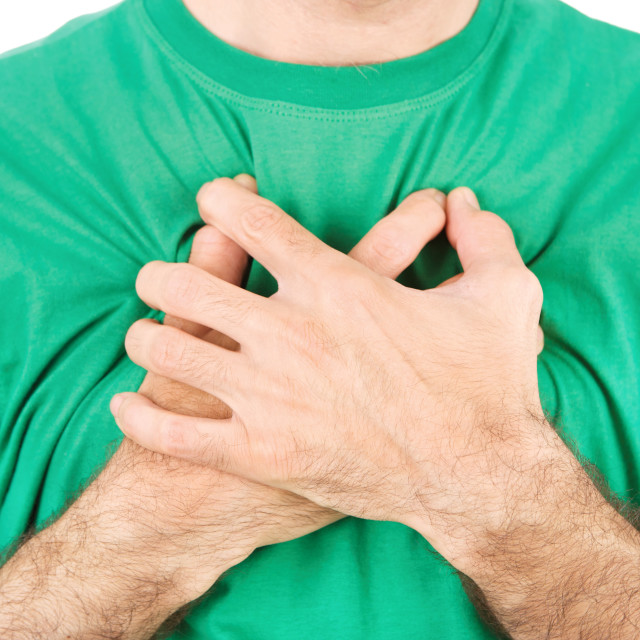 "Both man's hands on breast because of hard breathing" stock image