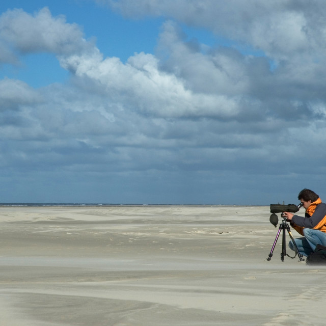 "Birdwatcher on beach, Vogelaar op strand" stock image