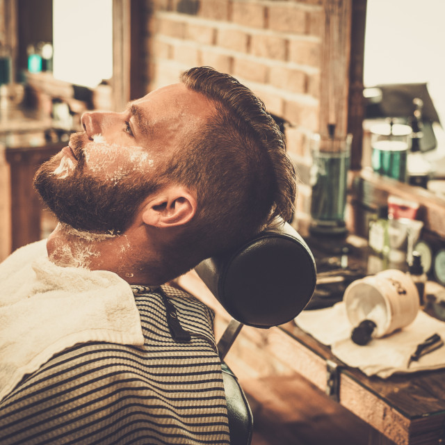 Client During Beard Shaving In Barber Shop License Download Or Print For £1860 Photos