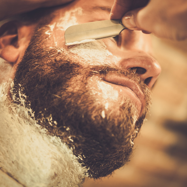 Client During Beard Shaving In Barber Shop License Download Or Print For £1860 Photos