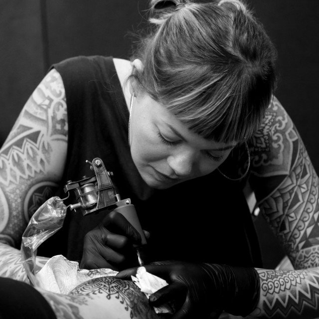 "tattooist Ema Sweeney" stock image
