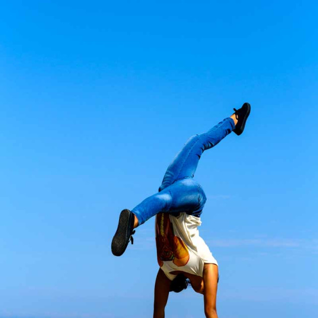 "Cartwheel on rock wall" stock image