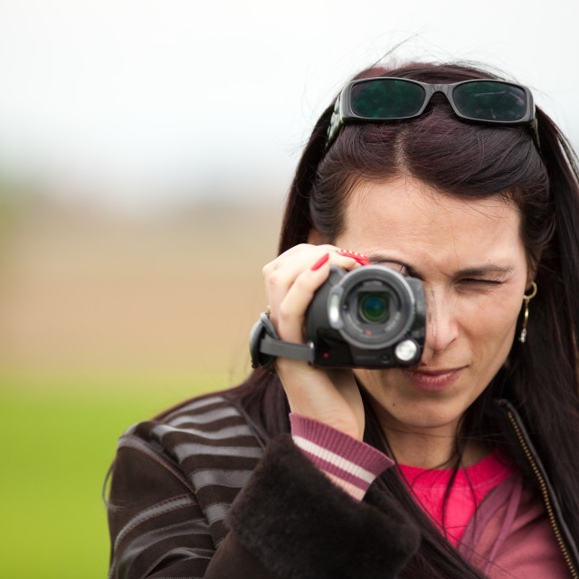 Attractive mature woman using her stock footage photo