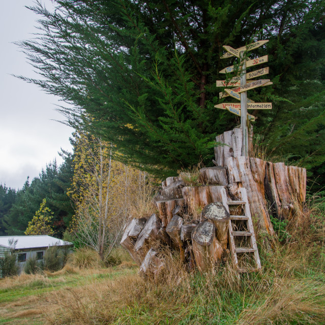 "A Wooden Sign points all the ways in New Zealand" stock image