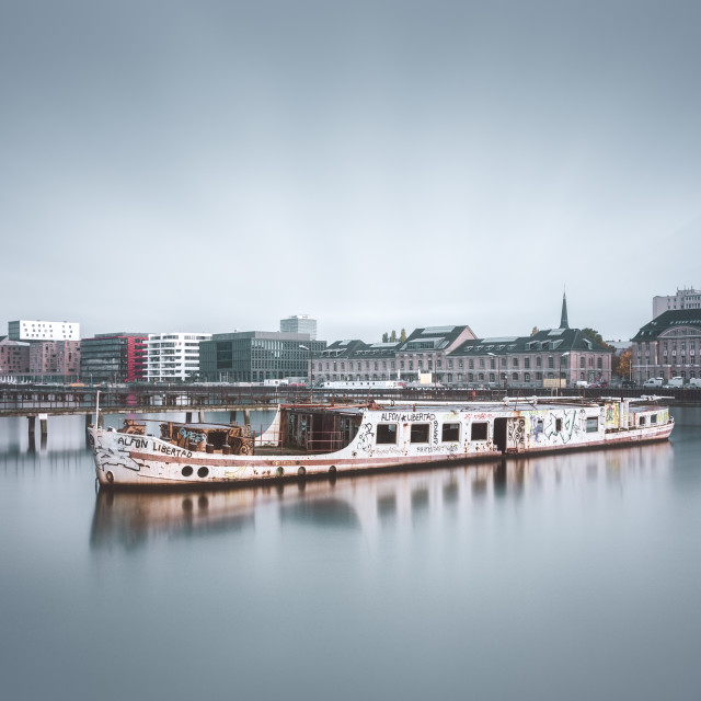 "Skyline of East-Berlin with an abandoned ship in the foreground" stock image
