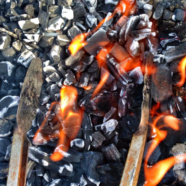 "BBQ coals and tongs" stock image