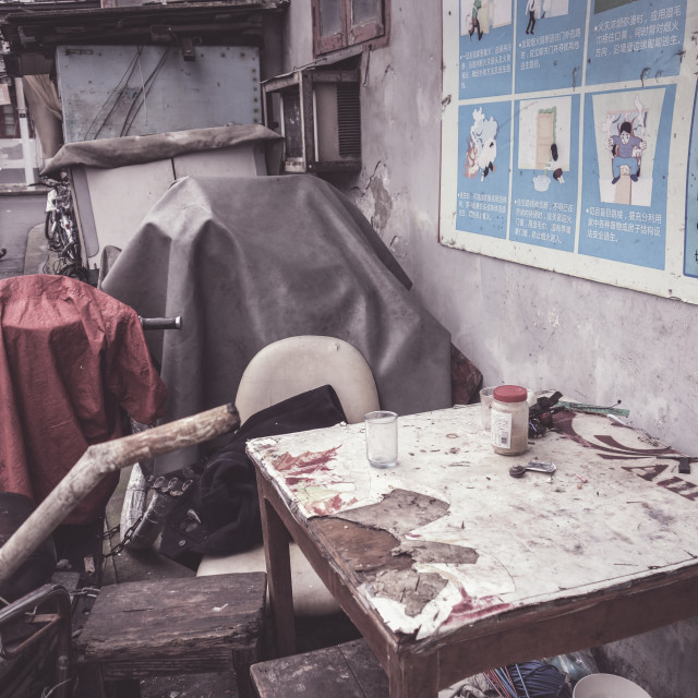 "Run-down table in an alley" stock image