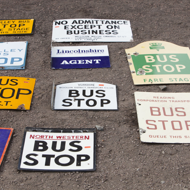 old bus stop signs at a railway enthusiasts sale in