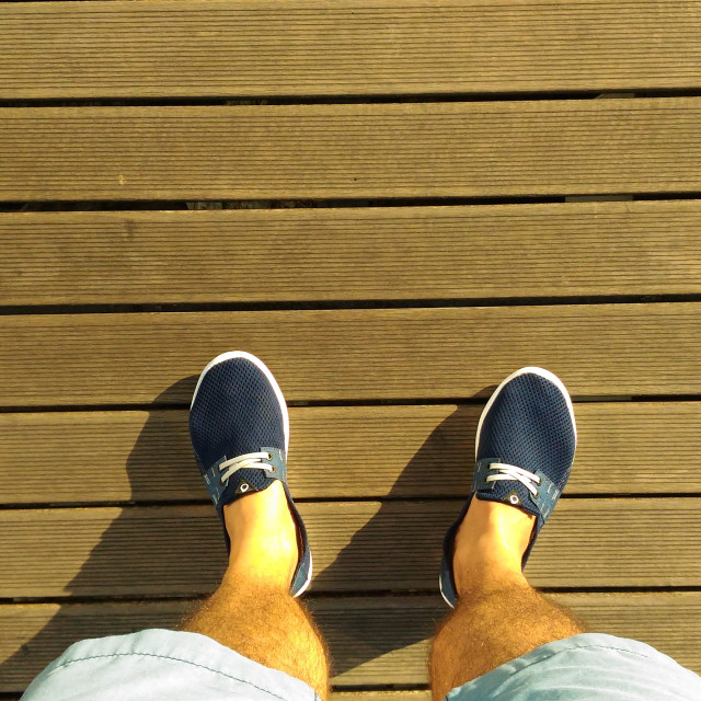 "looking down from above to feets and shoes" stock image