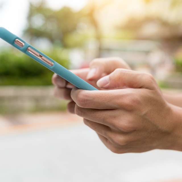 "Using mobile phone in the street" stock image