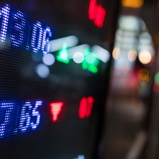 "Stock market price display in the city at night" stock image