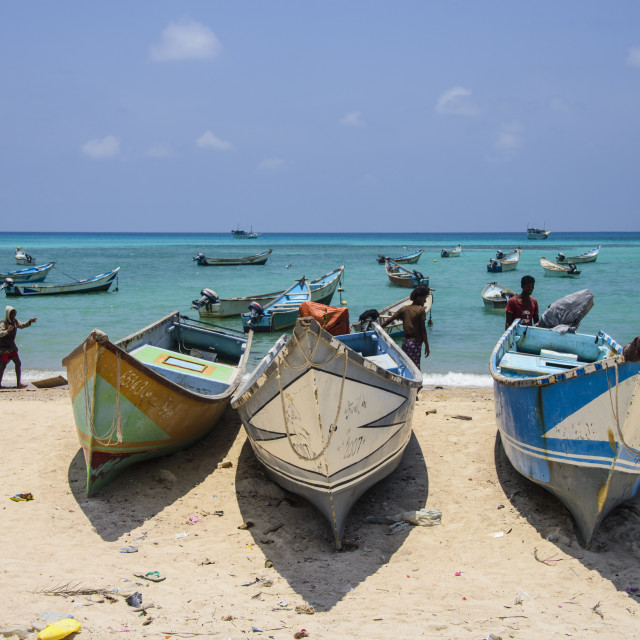 "Fishing boats in the turquoise waters of Qalansia on the west coast of the..." stock image