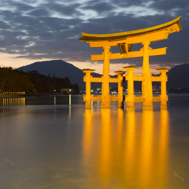 "The floating Miyajima torii gate of Itsukushima Shrine at dusk, UNESCO World..." stock image