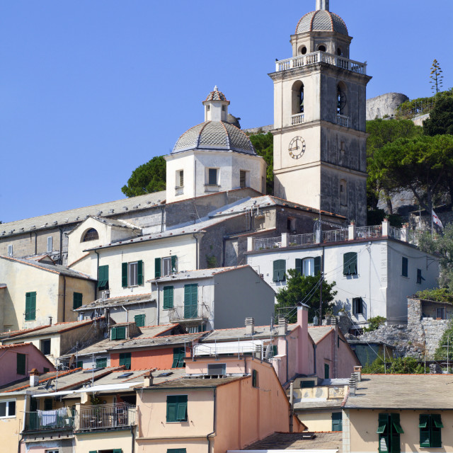 "The Church of St. Lawrence sits above colourful buildings at Porto Venere,..." stock image