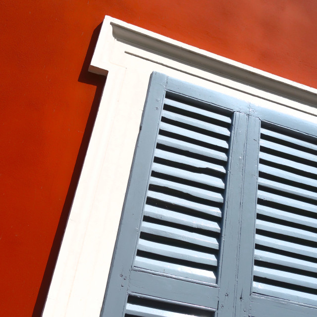 "Wooden shutters on a red wall" stock image