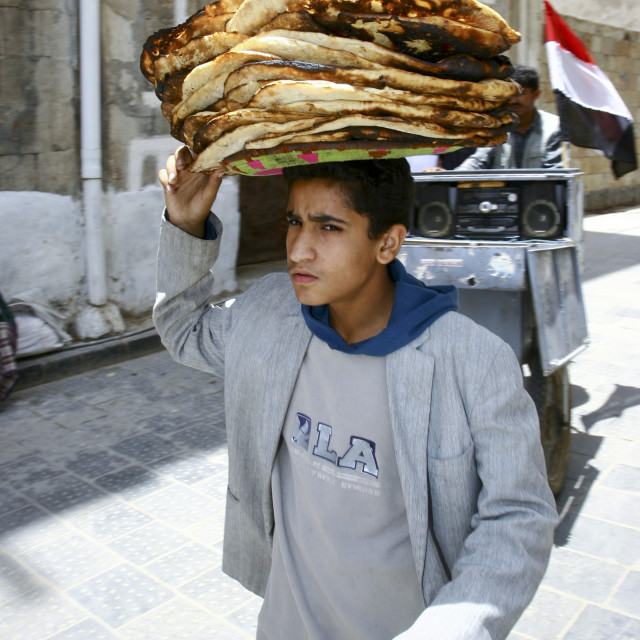"Boy Holding A Plate Of Bread, Sanaa, Yemen" stock image