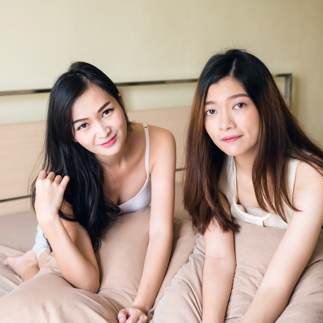 640px x 640px - young asian lesbian women couple on bed - License, download or print for  Â£12.40 | Photos | Picfair