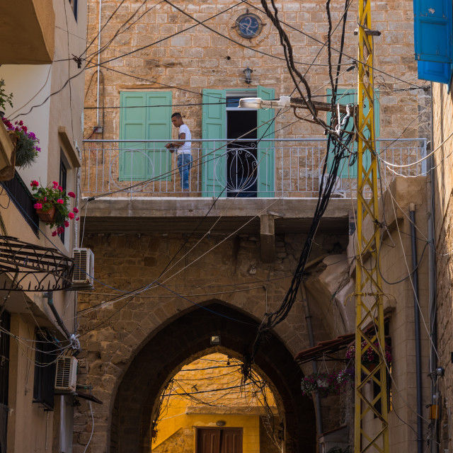 "Lebanese man on the balcony of his traditonal house in the old city, South..." stock image