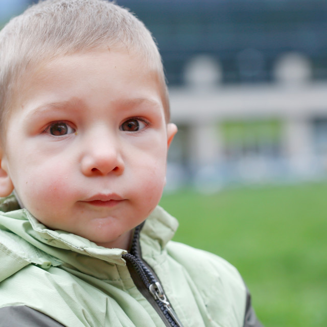 "Close up exterior portrait of boy waring autumn jacket" stock image