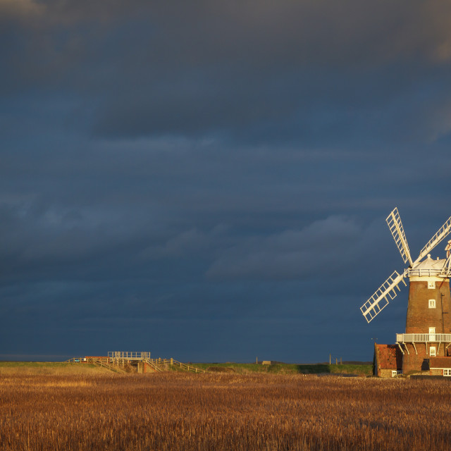 "Storm clouds move in over the reedbeds towards Cley Windmill at Cley Next the..." stock image