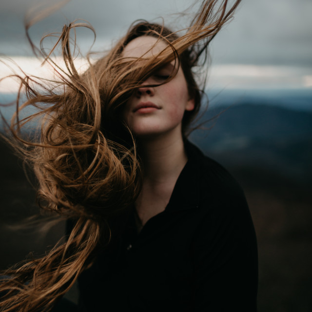 Young Woman  With Wind  Blowing Her Hair  License download 