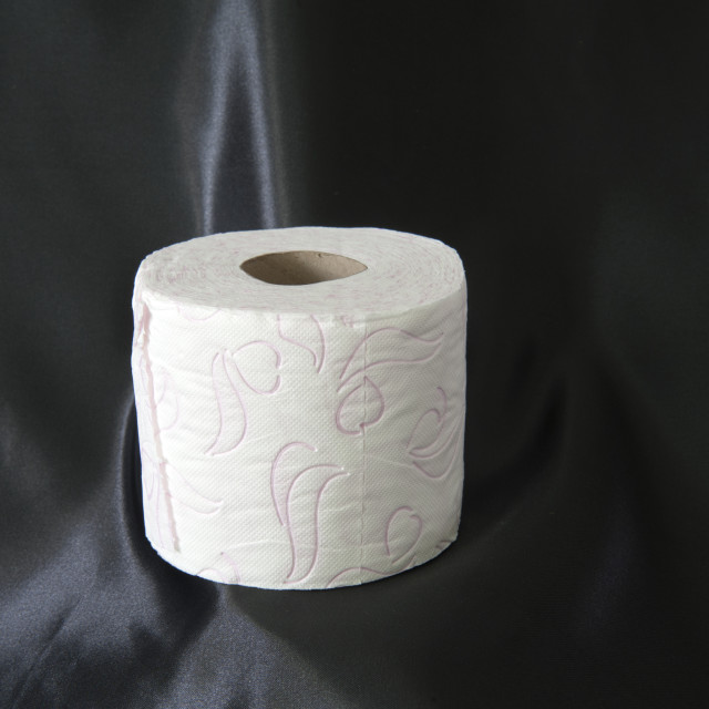 "Toilet paper on a black satin background." stock image