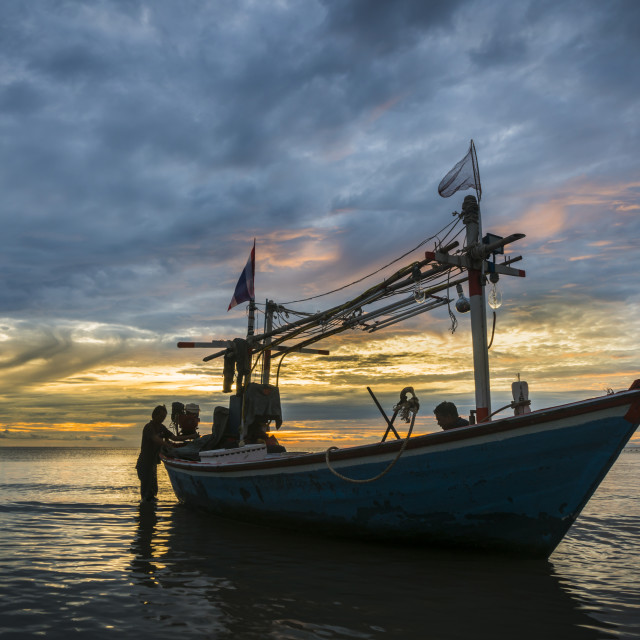 "Tropical fishing boat in dawn" stock image