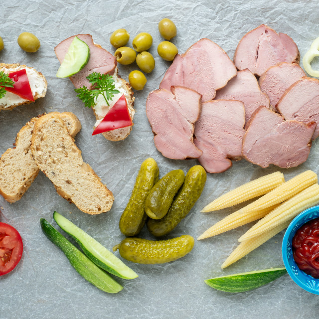 "Cold appetizer. Cold cuts. Different snacks on a white crumpled" stock image
