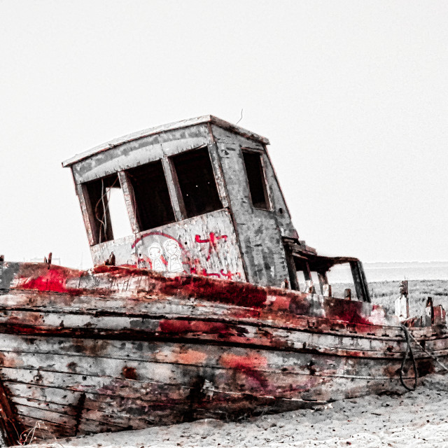 "Color Splash of an Old Wooden Fishing Boat on Land" stock image