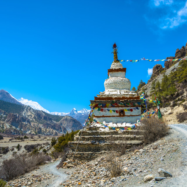"Stone stupa on the edge of a mountain road, Nepal." stock image