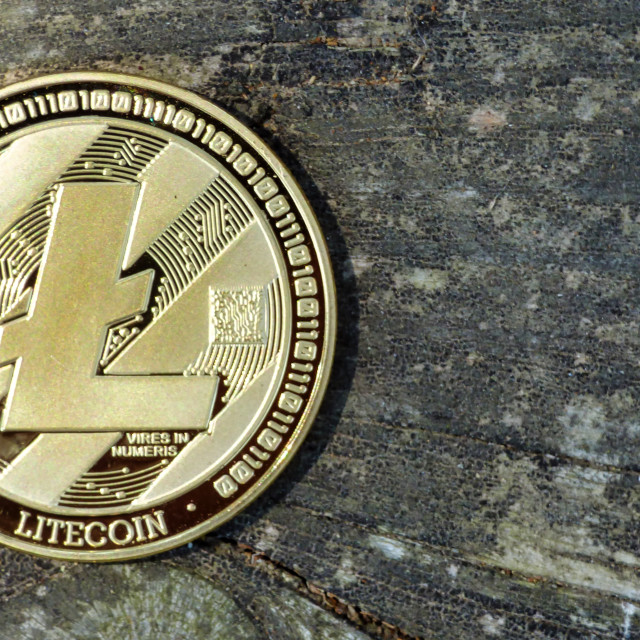 "Litecoin coin on wooden background" stock image