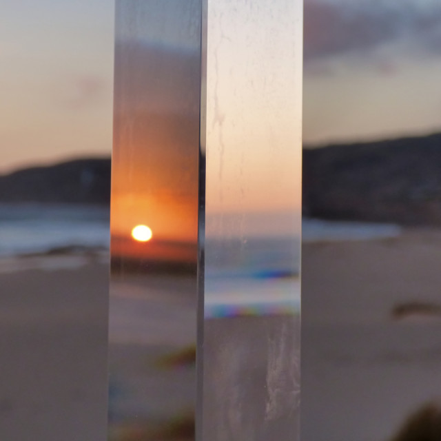 "Sun reflex on crystal prism on the beach" stock image