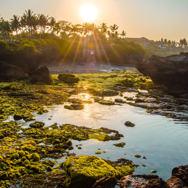 "Sunrise over black beach in Bali" stock image