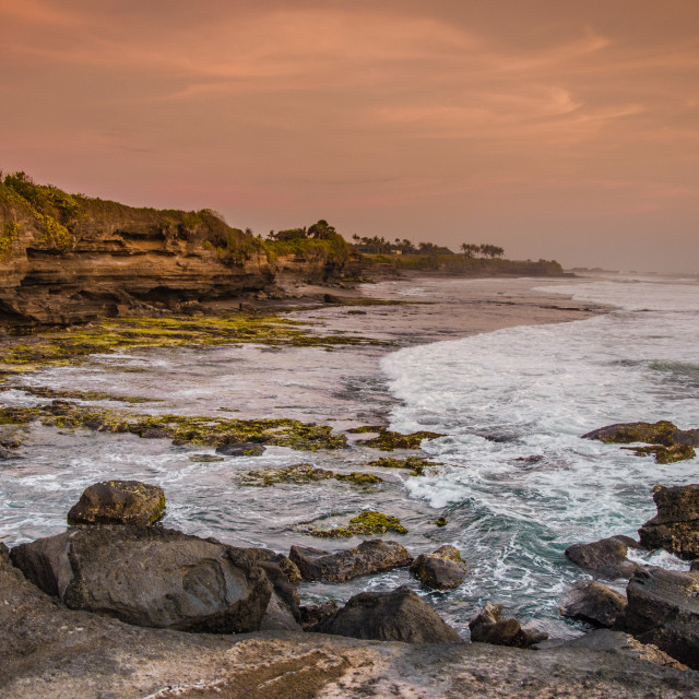 "Beach in Bali at orange sunset" stock image