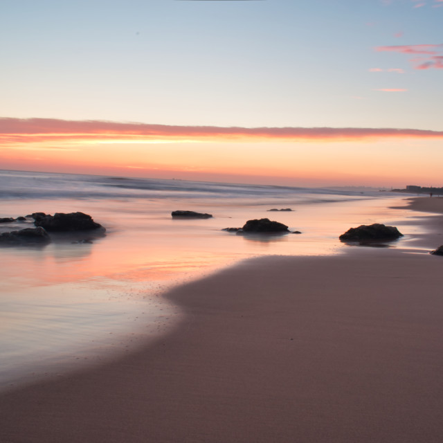 "Beach water at sunset long exposure" stock image