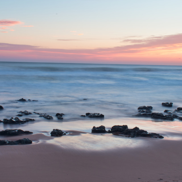 "Beach water at sunset long exposure" stock image