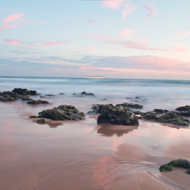 "Beach water at sunset long exposure" stock image