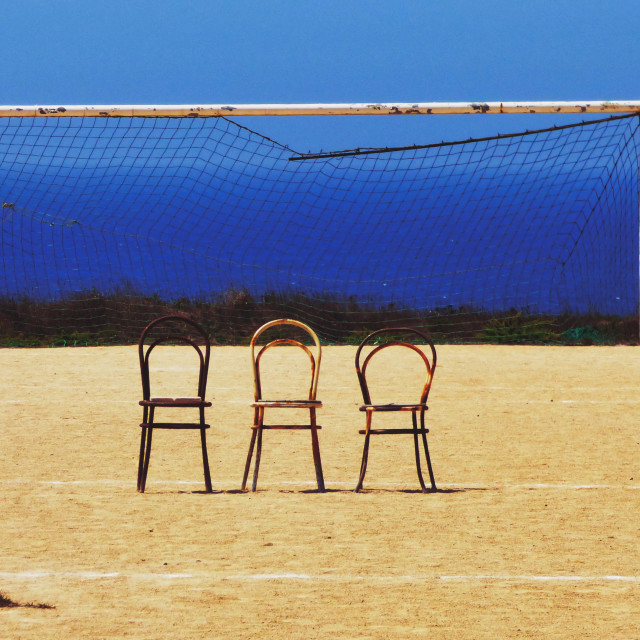 "Old Rusty chairs in a soccer field" stock image