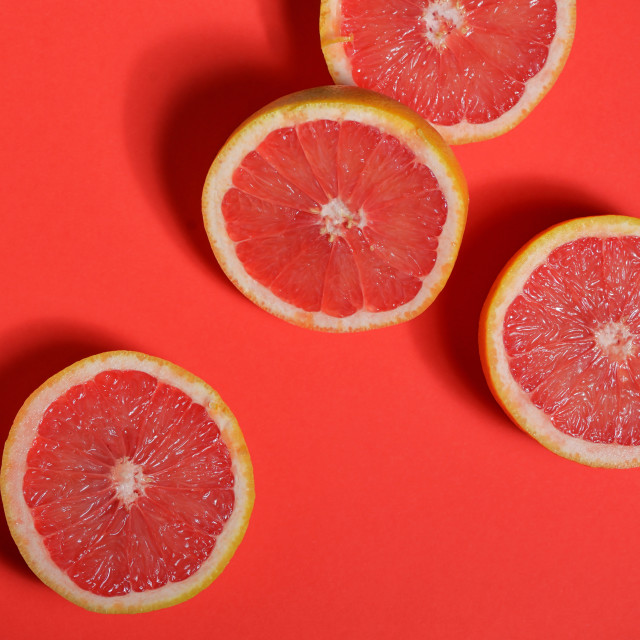 "Red grapefruit halves" stock image