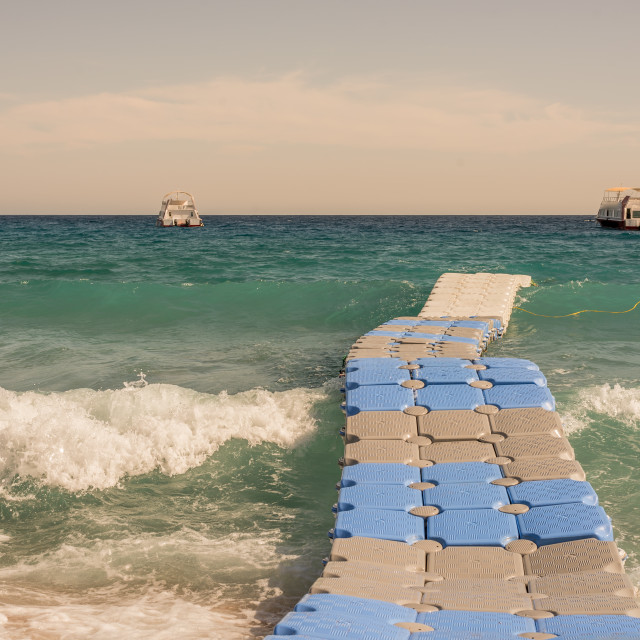 "the waves comming ashore and move a Floating bridge" stock image