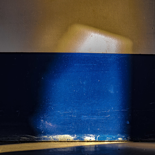 "SUN BEAM ON BLUE PAINTED CONCRETE WALL" by JOHN MOUNT - $25.14 "SUN BEAM ON BLUE PAINTED CONCRETE WALL" stock image