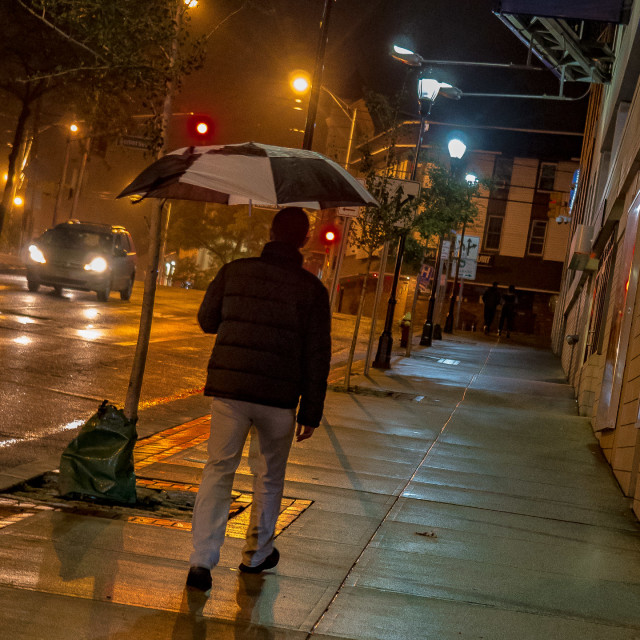 "MAN WITH UMBRELLA, RAINY NIGHT IN THE CITY" by JOHN MOUNT - $25.14 "MAN WITH UMBRELLA, RAINY NIGHT IN THE CITY" stock image