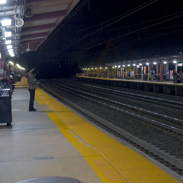 "WOMAN WAITING AT TRAIN STATION" by JOHN MOUNT - $25.14 "WOMAN WAITING AT TRAIN STATION" stock image