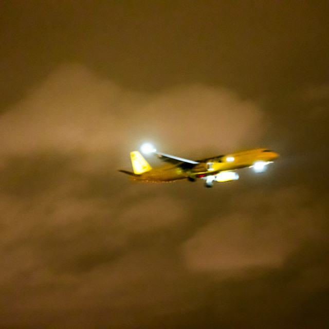 "AIRPLANE FLYING AT NIGHT IN THE CLOUDS" by JOHN MOUNT - $25.14 "AIRPLANE FLYING AT NIGHT IN THE CLOUDS" stock image