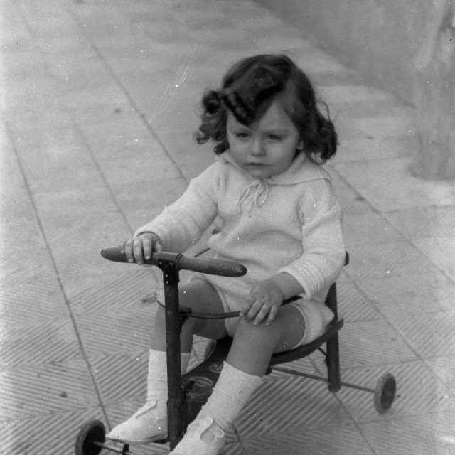 "VINTAGE PORTRAIT OF LITTLE GIRL RIDING A WHEELED TOY" by JOHN MOUNT - $25.10 "VINTAGE PORTRAIT OF LITTLE GIRL RIDING A WHEELED TOY" stock image