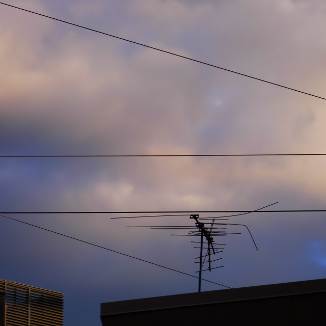 "TV Antenna on top an urban building" by JOHN MOUNT - $24.67 "TV Antenna on top an urban building" stock image