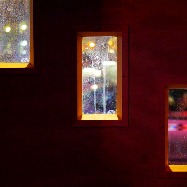 "Three Windows looking out to a colorful street at night" by JOHN MOUNT - $24.67 "Three Windows looking out to a colorful street at night" stock image