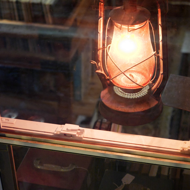 "Lantern in the window of a record store" by JOHN MOUNT - $24.67 "Lantern in the window of a record store" stock image
