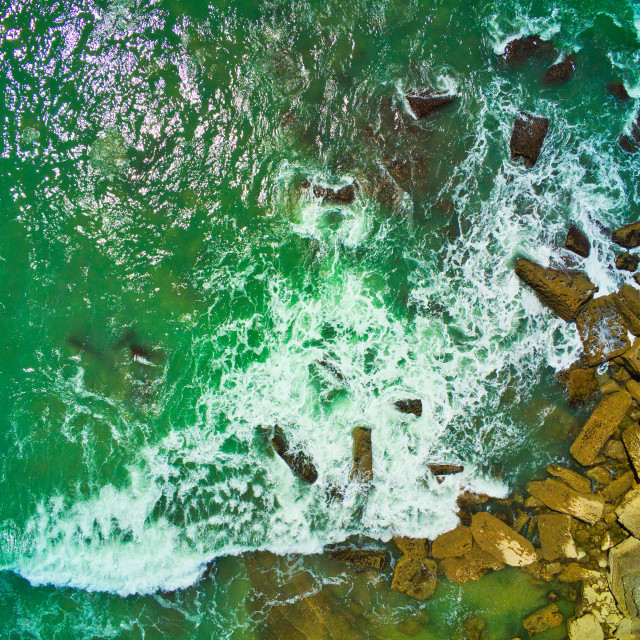 "Eagle view of water and rocks on seaside" stock image